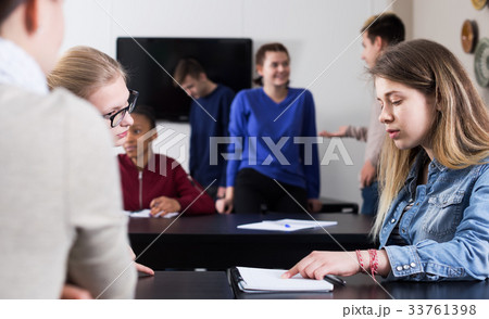 Girl consulting fellow student 33761398