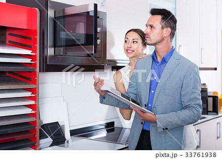 middle class satisfied family selecting kitchen furniture 33761938
