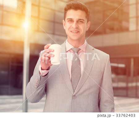 Businessman drinking coffee Businessman drinking coffee 33762403