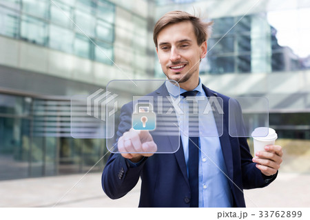 Businessman touching virtual interface 33762899