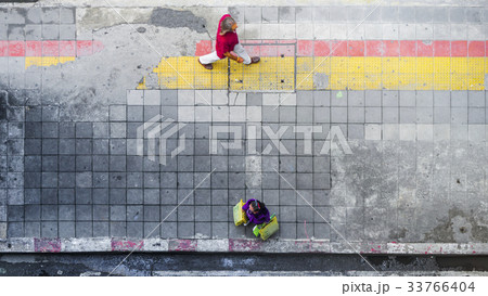 On street walk in top view man and woman On street walk in top view man and woman 33766404
