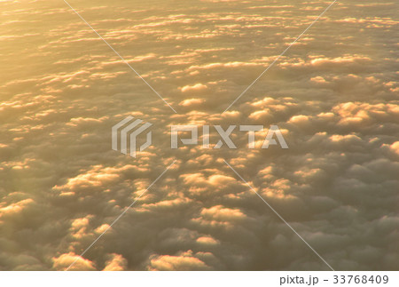 view over white fluffy cloud with sunrise view over white fluffy cloud with sunrise 33768409