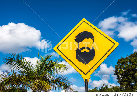 Hipster barber shop road sign over blue sky 33773805