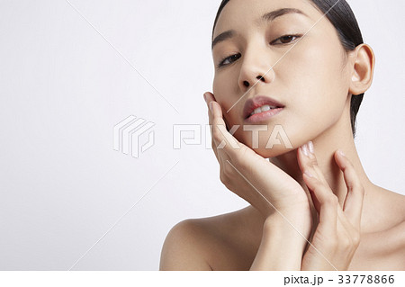 portrait of a beautiful girl posing in a white background 33778866