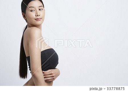 A beautiful girl is posing in a white background A beautiful girl is posing in a white background 33778875