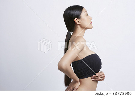 portrait of a girl with a long hair posing and looking at something portrait of a girl with a long hair posing and looking at something 33778906