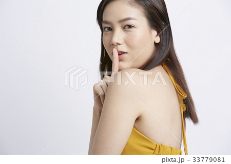 portrait of beautiful woman making silent sign portrait of beautiful woman making silent sign 33779081