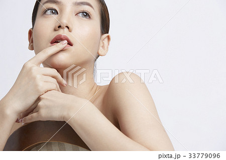 naked woman is sitting and touching her lips naked woman is sitting and touching her lips 33779096