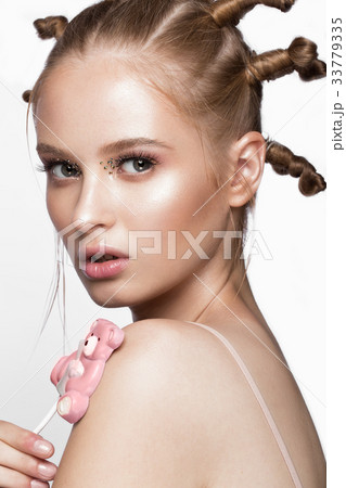 Portrait of beautiful cute girl with fun hairstyle 33779335