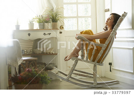 portrait of a girl sitting on the chair and sleeping portrait of a girl sitting on the chair and sleeping 33779397