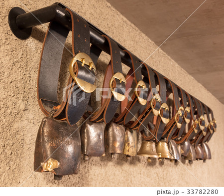 Swiss cowbells hanging at an farm in the Alps Swiss cowbells hanging at an farm in the Alps 33782280