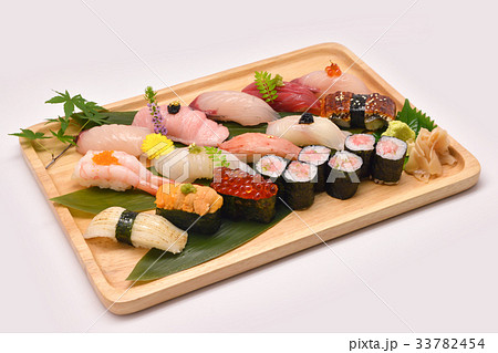 Mixed sushi set in brown wooden tray 33782454