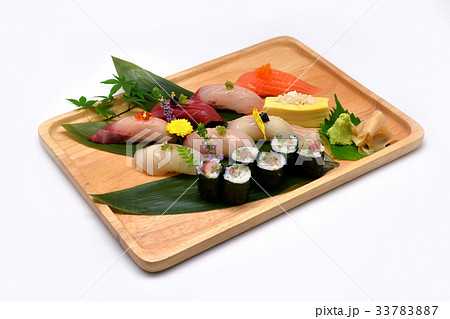 Mixed sushi set in brown wooden tray Mixed sushi set in brown wooden tray 33783887