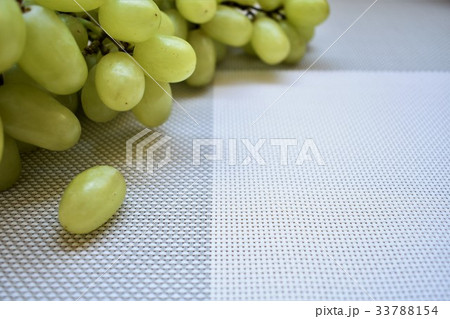 Ripe grapes on the grey tablecloth, copy space. 33788154