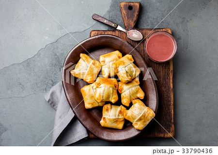Mini chilean empanadas on clay plate with typical 33790436