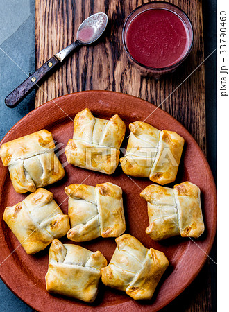 Mini chilean empanadas on clay plate with typical 33790460