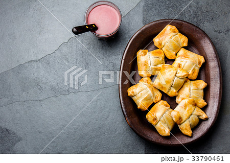 Mini chilean empanadas on clay plate with typical 33790461