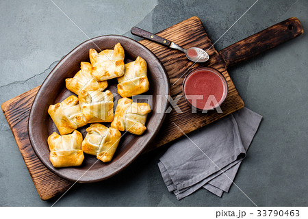 Mini chilean empanadas on clay plate with typical 33790463