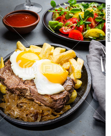 Peruvian Latin American food. Lomo a lo pobre 33790561