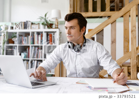 Young businessman in office Young businessman in office 33793521
