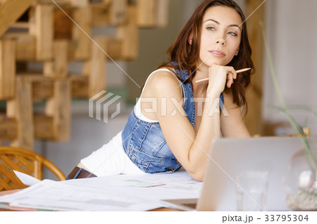 Young woman standing in creative office Young woman standing in creative office 33795304