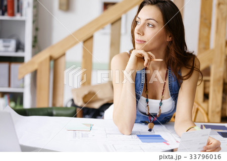 Young woman standing in creative office Young woman standing in creative office 33796016