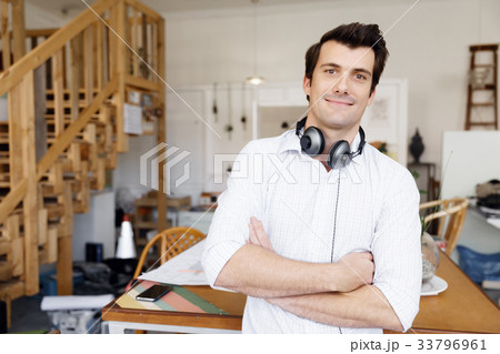 Portrait of young man wearing casual in office 33796961
