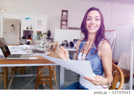 Young woman standing in creative office Young woman standing in creative office 33797045