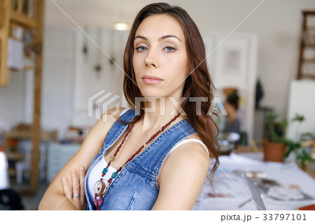 Young woman standing in creative office 33797101