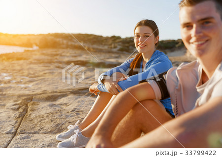 Couple in sport wear on beach Couple in sport wear on beach 33799422