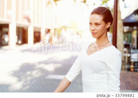 Portrait of business woman smiling outdoor 33799881