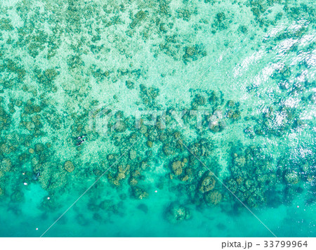 Aerial view or top view of tropical island beach Aerial view or top view of tropical island beach 33799964