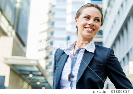 Portrait of business woman smiling outdoor 33800357