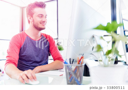 Young man working in office 33800511