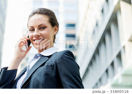 Portrait of business woman smiling outdoor Portrait of business woman smiling outdoor 33800516