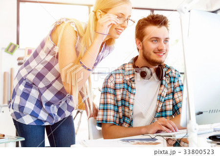 Two office workers at the desk 33800523