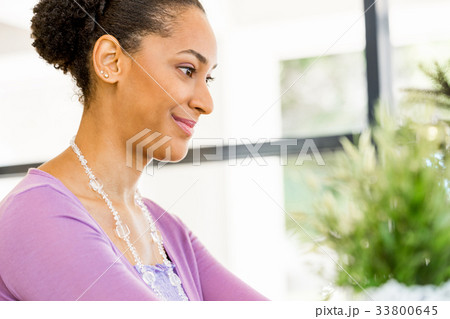 Portrait of smiling afro-american office worker sitting in offfice Portrait of smiling afro-american office worker sitting in offfice 33800645