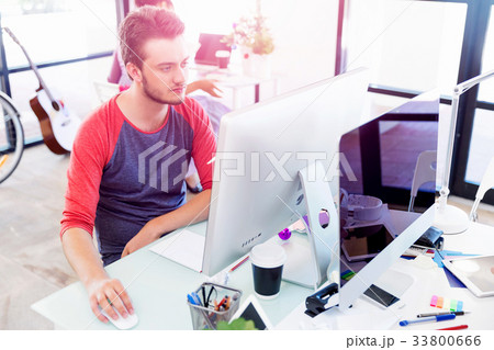 Young man working in office 33800666