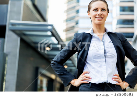 Portrait of business woman smiling outdoor 33800693
