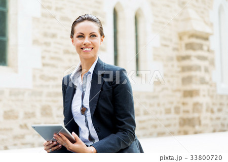 Portrait of business woman smiling outdoor Portrait of business woman smiling outdoor 33800720