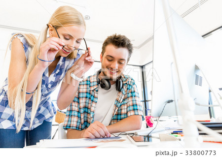 Two office workers at the desk 33800773