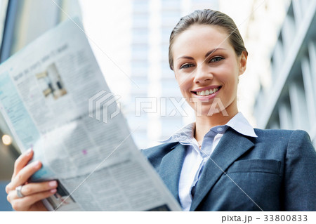 Portrait of business woman smiling outdoor 33800833