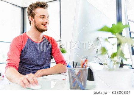 Young man working in office 33800834