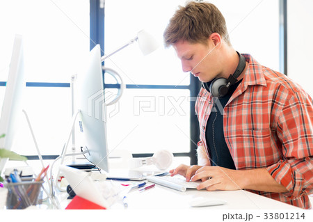 Young man working in office 33801214