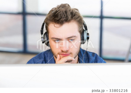 Young man working in office Young man working in office 33801216