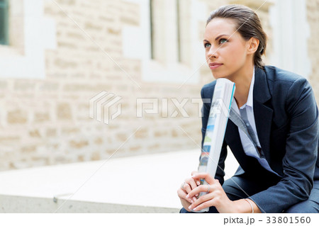 Portrait of business woman smiling outdoor 33801560