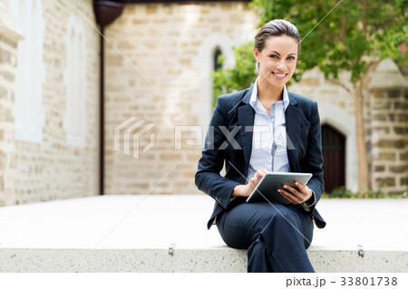 Portrait of business woman smiling outdoor 33801738
