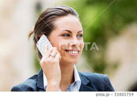 Portrait of business woman smiling outdoor 33801754