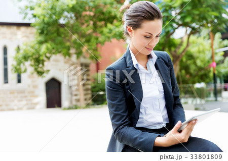 Portrait of business woman smiling outdoor 33801809