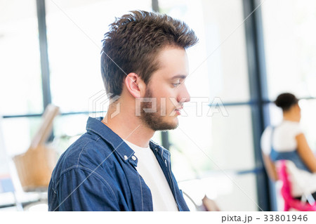 Young man working in office 33801946